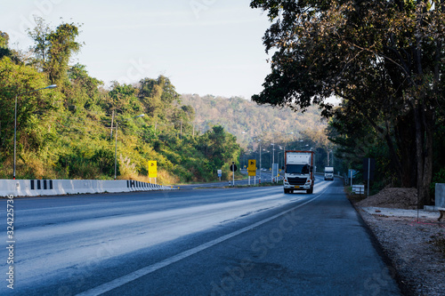 Beautiful green road in countryside, Landscape road with green forest, Main road on the mountain