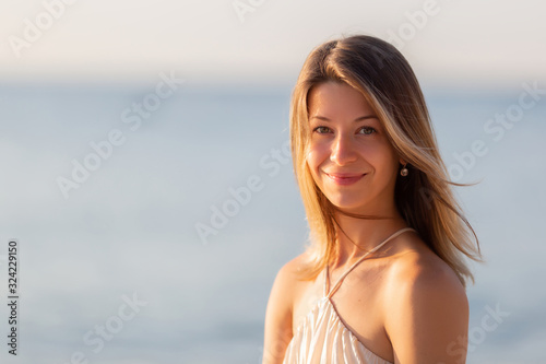 Seaside Happiness: Close-Up Portrait of a Joyful Woman