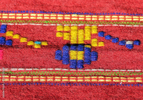 Kosovo, Zvecan, July 16, 2018: Hand made rug, colorful surface, texture of traditional woolen and vintage hand made rug photo