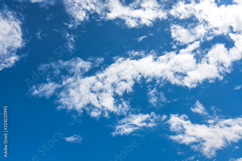 Blue sky with white clouds under sunshine