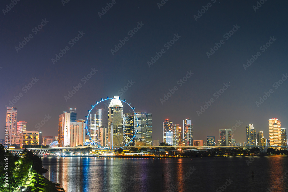 Naklejka premium Singapore Landscape of business building around Marina bay, Singapore Skyline at night view the business bay district on Marina bay at dusk