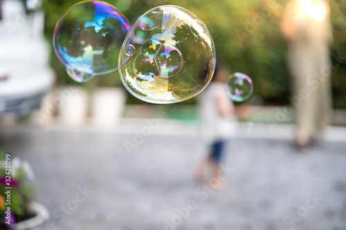 Floating soap bubbles in garden.