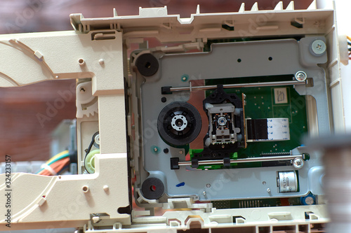 Disassembled cd-rom optical drive for a desktop personal computer. Repair and maintenance of electronics.