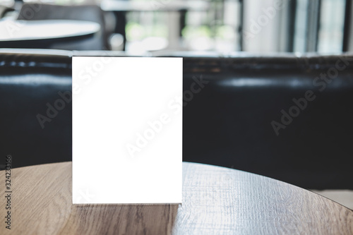 Mock up acrylic frame posters pattern template forms background, blank menu frame on table in coffee shop stand for your text of display your product photo