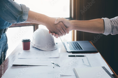 Meeting and greeting, Two engineer or architect meeting for project, handshake after consultation and conference new project plan, contract for both companies, success, partnership