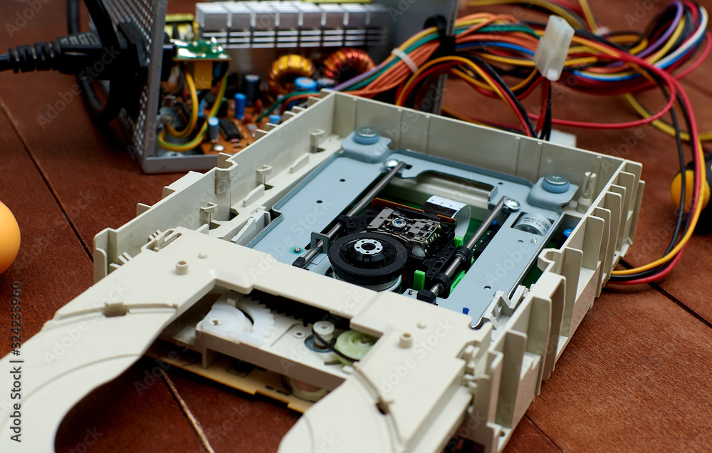 Disassembled cd-rom optical drive for a desktop personal computer. Repair and maintenance of electronics.