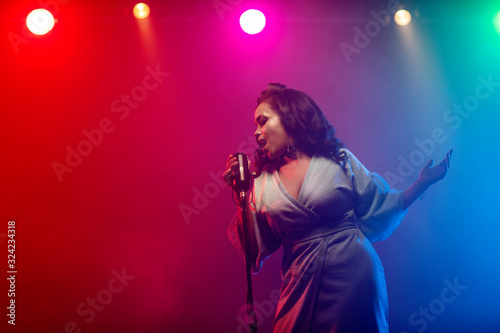 Photography A jazz singer performs on stage. Afro.