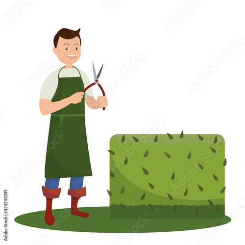 Smiling man holding a pruning shears in his hands standing next to a green bush. Isolated on white background. Vector stock illustration