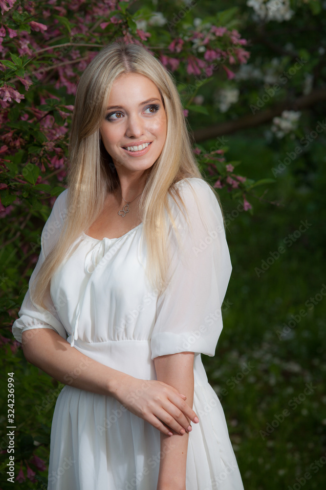 Portrait of beautiful young girl in summer garden. Portrait of beautiful young girl in summer garden.