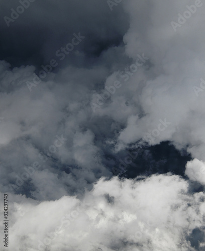 Fragment of a stormy sky with white clouds