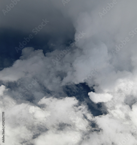 Fragment of a stormy sky with white clouds
