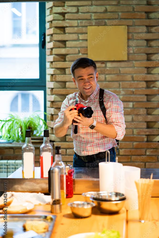 male photographer working in the kitchen male photographer working in the kitchen