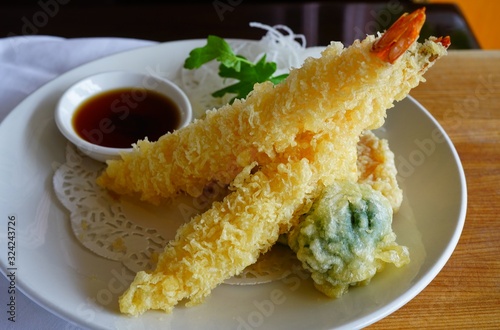 Deep-fried shrimp and vegetable tempura fritters at a Japanese sushi restaurant