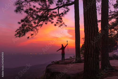 Young girl traveling   on the high mountain at Phu-kra-dueng national park Loei province  Thailand.