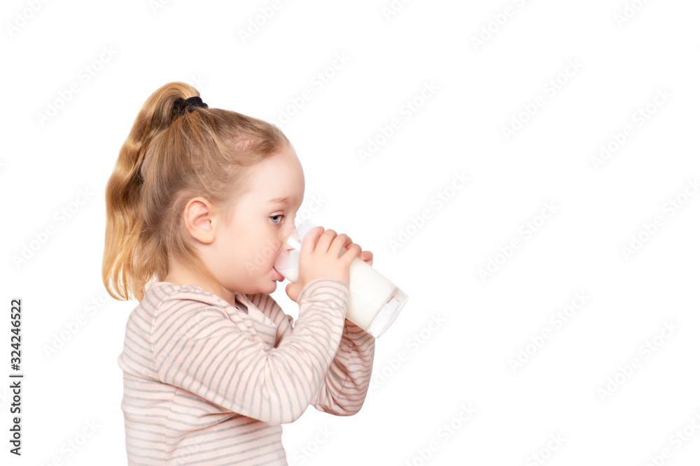 Little girl drinks milk from a glass isolated on white Little girl drinks milk from a glass isolated on white