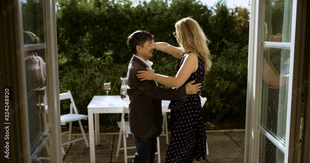 MS Senior Couple Dancing on Garden Patio. Shot in R3D (6K RED RAW) MS Senior Couple Dancing on Garden Patio. Shot in R3D (6K RED RAW)
