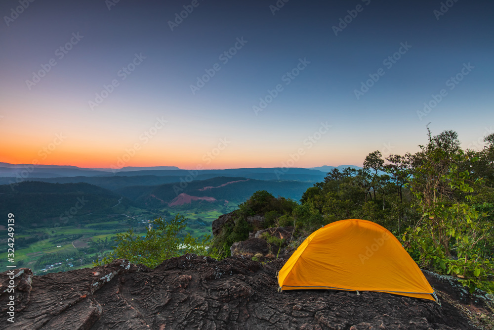 The orange tent's hikers  on the cliff at  Phu-E-Lerd, Loei province, Thailand.