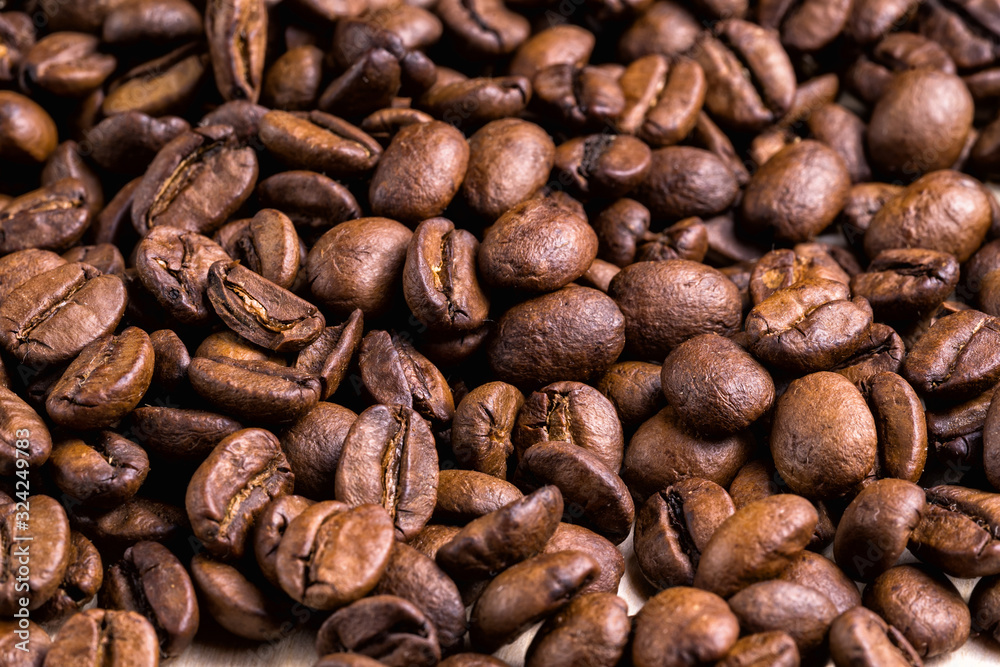 Bright brown roasted coffee beans background. Bright brown roasted coffee beans background.