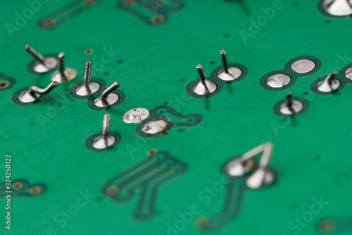 Chip green printed circuit board with the image of contacts. macro shot