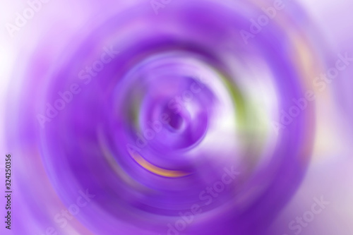 Blurred gradient radial motion purple lilac violet background. Mixed circular texture