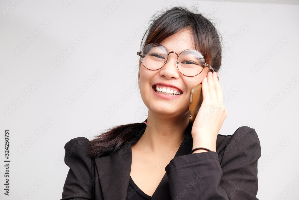 Business asian womenuse smartphone business talking wear black suit on white background communication business