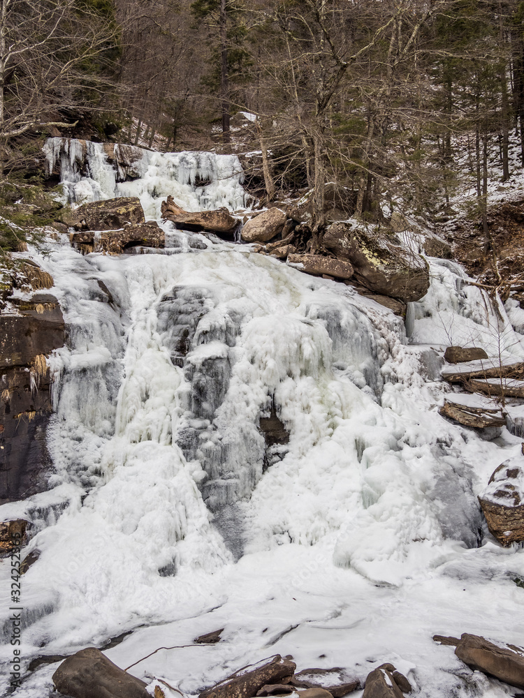 Frozen low Kaaterskill Falls in winter Catskill mountains