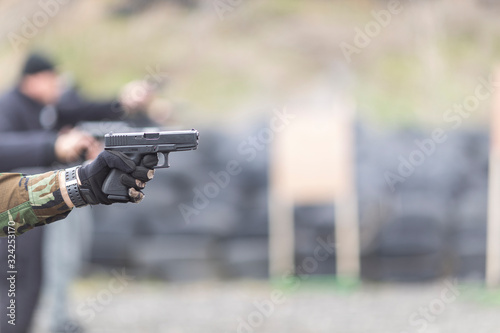 police, army and border police gun training. firing weapons and pistols. gun shooting exercise. detailed shots of gun, bullets and shells.