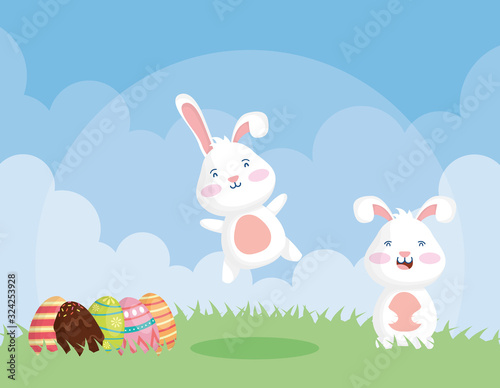 happy easter celebration card with rabbits and eggs painted
