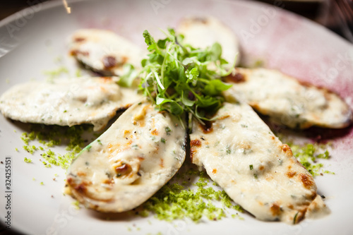 Cooked green mussels with parmegano and cream cheese