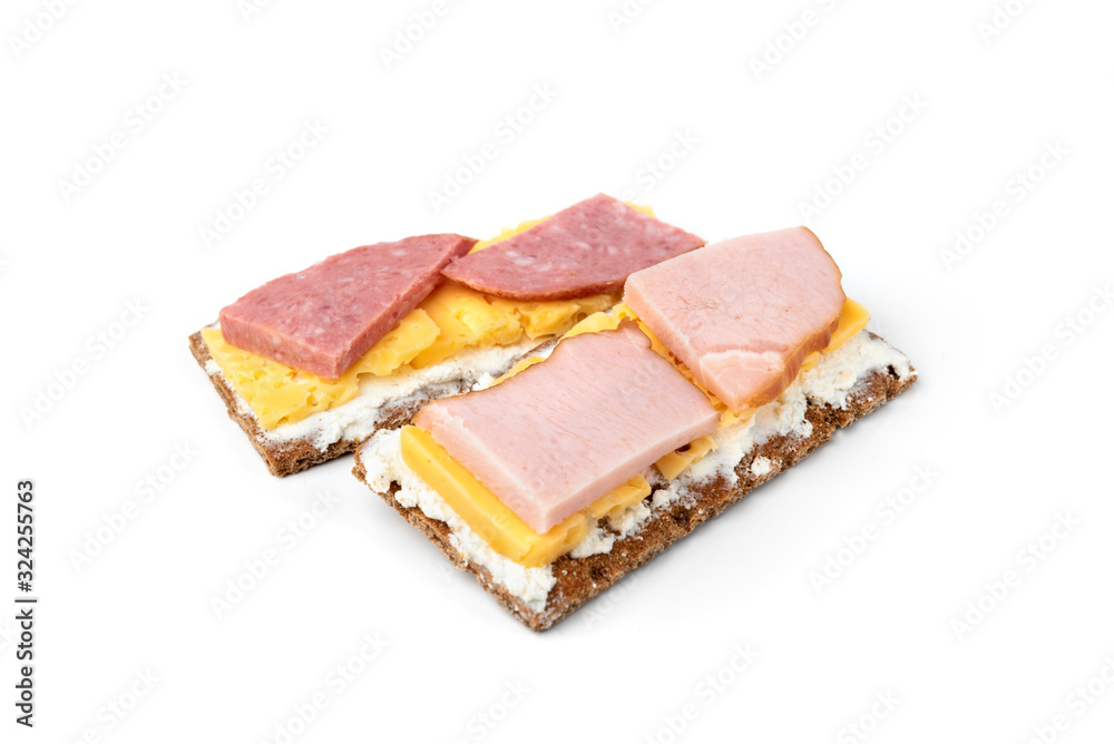 Crisp bread with cheese and sausage isolated on white background. Crisp bread with cheese and sausage isolated on white background.