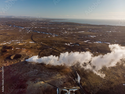 Aerial view of steam cloud of hot sulfur spring in Iceland  photo