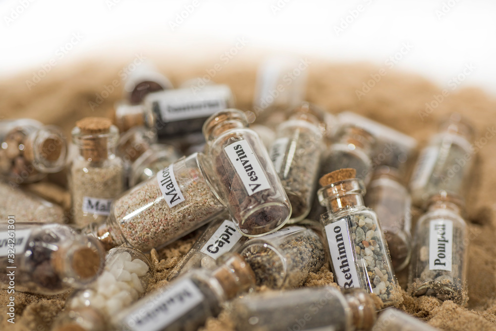 Glass test-tube with sand of different summer vacation countries. Glass test-tube with sand of different summer vacation countries.