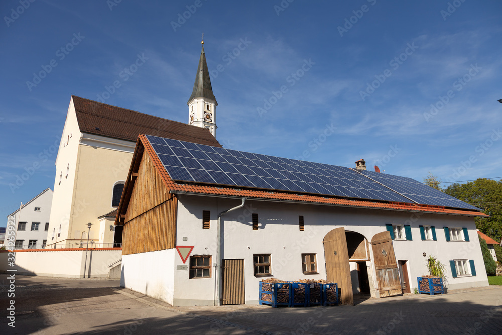 Obraz premium Farm with solar panels in a small village in Bavaria, Germany