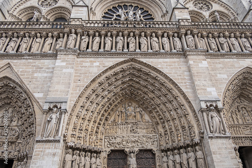 Architectural fragments of Cathedral Notre Dame de Paris. Notre Dame de Paris - a most famous Gothic, Roman Catholic cathedral (1163 - 1345) on the eastern half of the Cite Island. Paris, France.