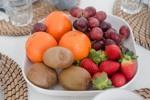 Fototapeta Naklejka Na Ścianę i Meble -  Fresh mixed tropical fruits on plate for breakfast
