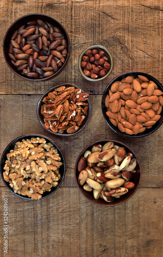 Bowls with nuts, chestnuts, almonds and hazelnuts