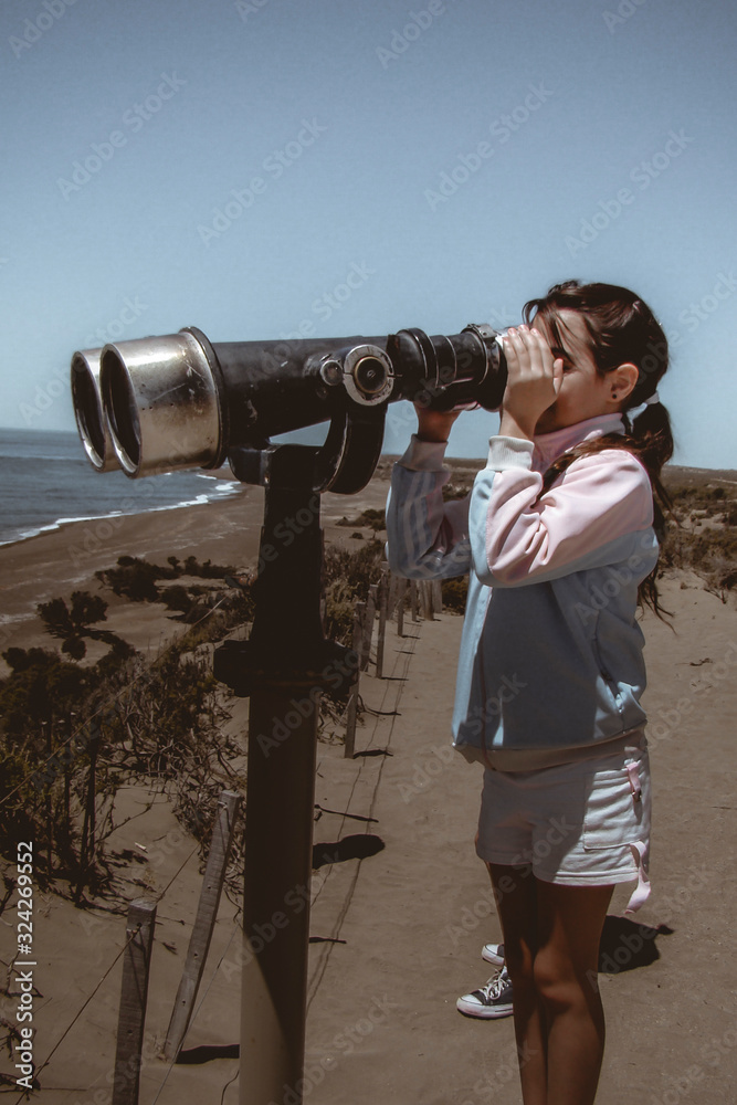 girl looked at by binoculars