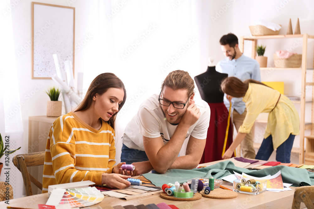 Fototapeta premium Fashion designers creating new clothes in studio