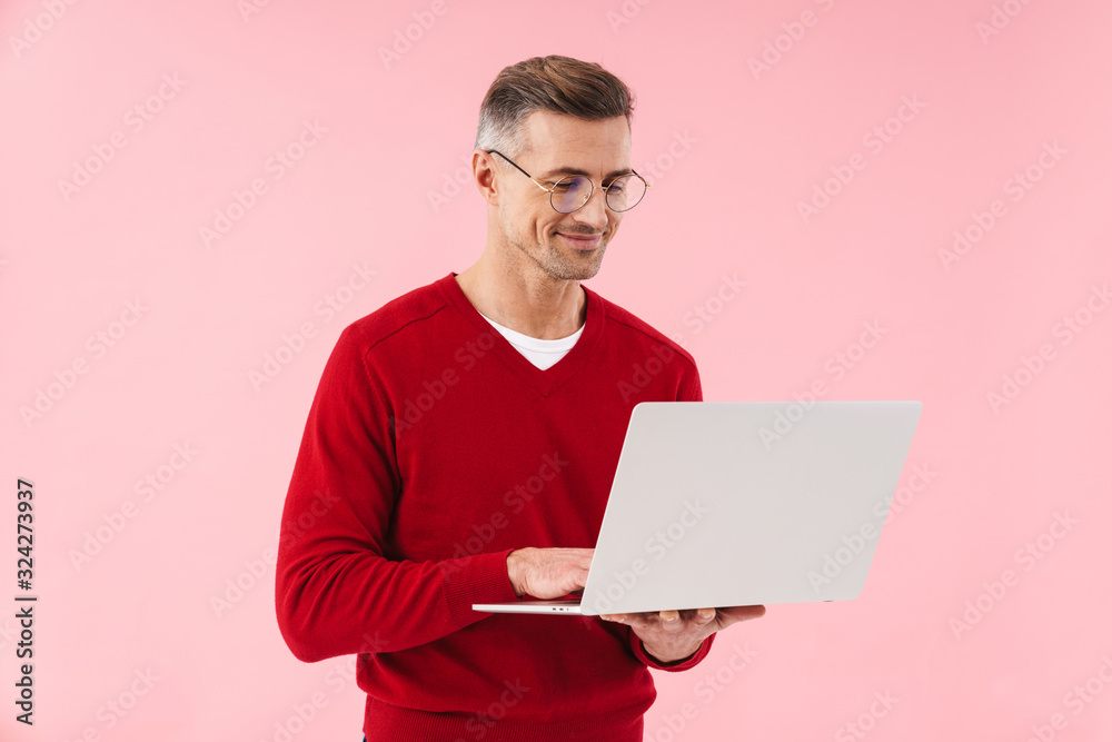 Mature man using laptop computer. Mature man using laptop computer.