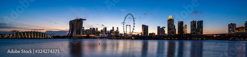 Super wide panorama of Singapore skyline at magic hour time