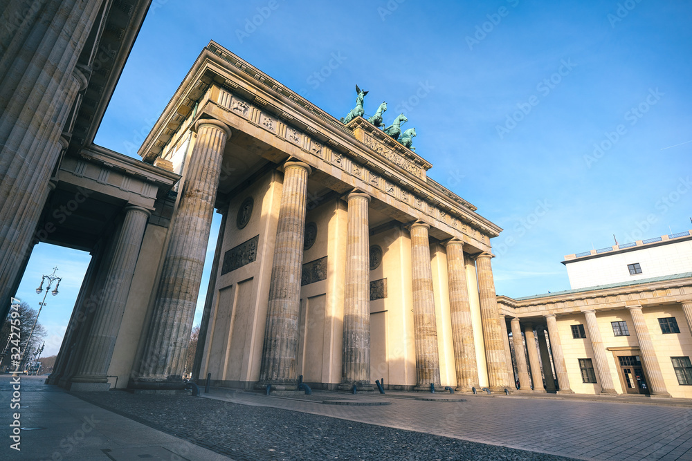 The famous Brandenburg Gate in Berlin in front of a clear blue sky