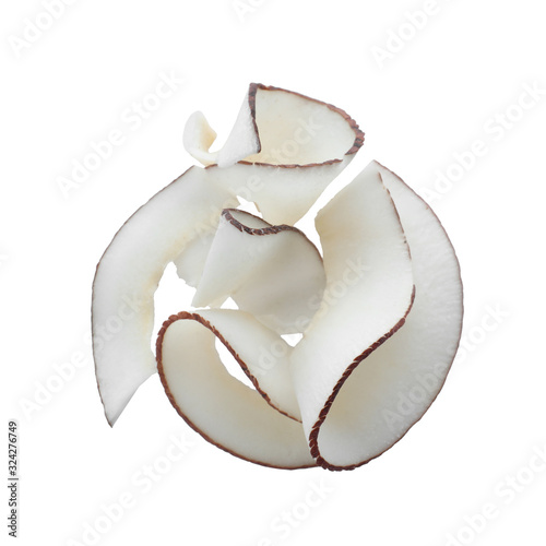 Pile of fresh coconut flakes isolated on white, top view