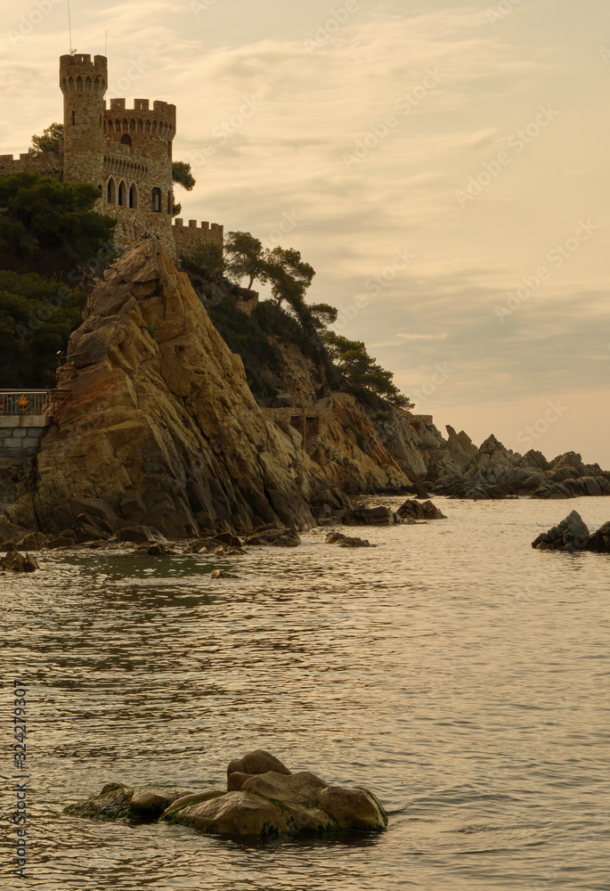 Castle on a cliff with the sea and rocks in the background, Girona