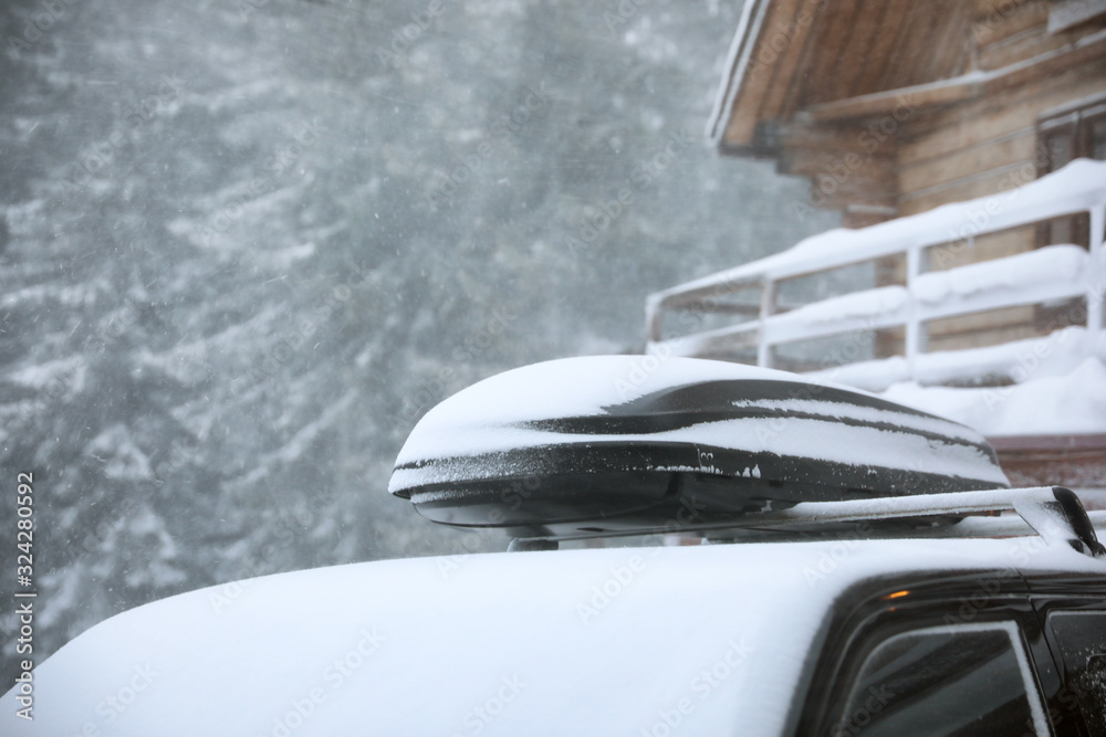 Modern car covered in snow outdoors on winter day, closeup Modern car covered in snow outdoors on winter day, closeup