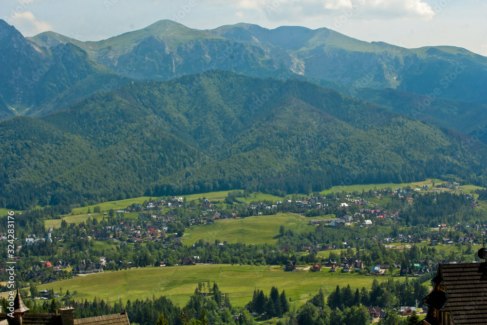 Region at the foot of the Tatra Mountains. Zakopane town in Poland. Panorama of high mountains.