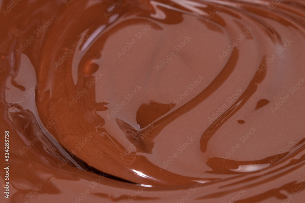 Chocolate texture. Liquid chocolate close-up.Textured dark chocolate Chocolate texture. Liquid chocolate close-up.Textured dark chocolate