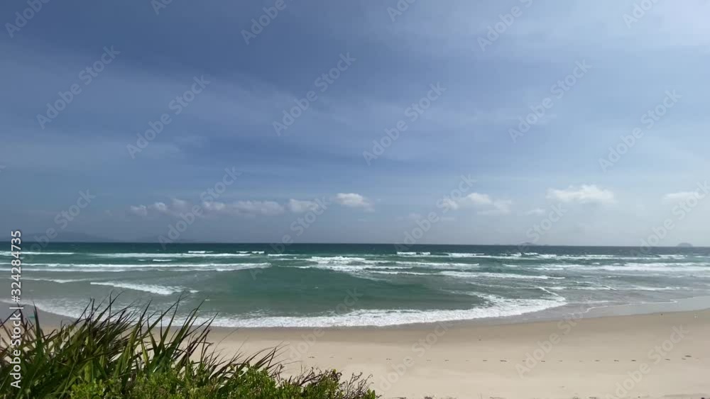 Empty sand beach with blue sea and blue sky background. Empty sand beach with blue sea and blue sky background.