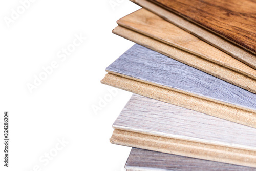 Laminate. Samples of laminate and floorboard. Cutting and laying flooring.