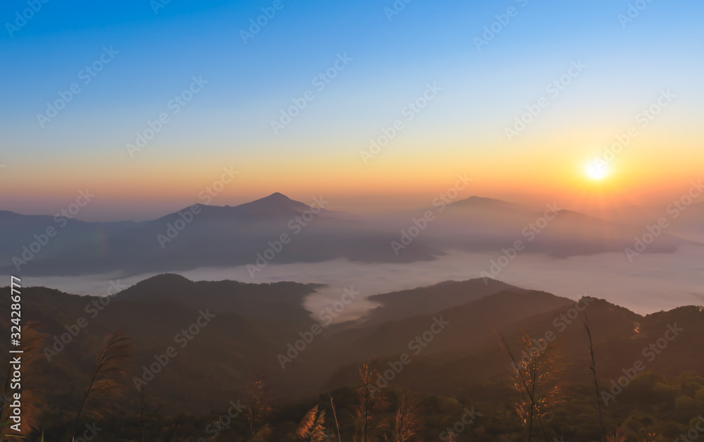 Landscape images of High mountains range, sunrise in the morning And white mist covering the mountains, beautiful nature background