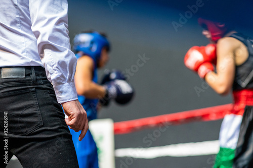 Two young guys boxing